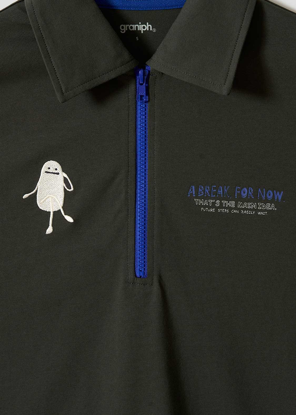 Via Artists half-zip dark green T-shirt with embroidered character and blue zipper detail
