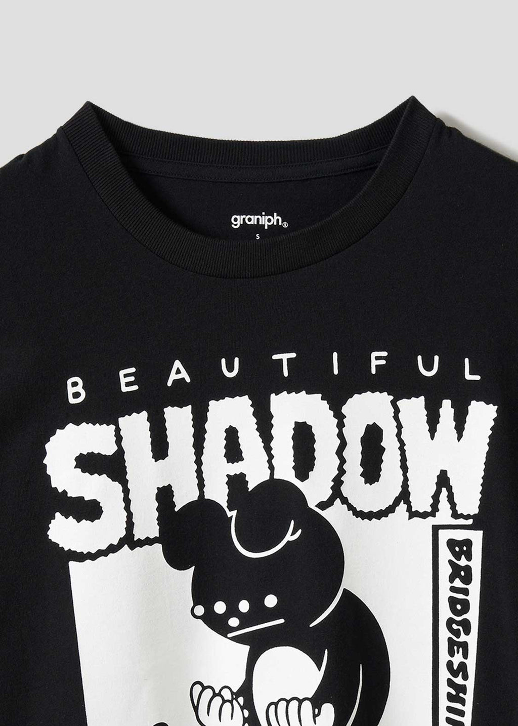 Black t-shirt with 'Beautiful Shadow' graphic design on a light gray background