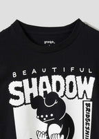 Black t-shirt with 'Beautiful Shadow' graphic design on a light gray background