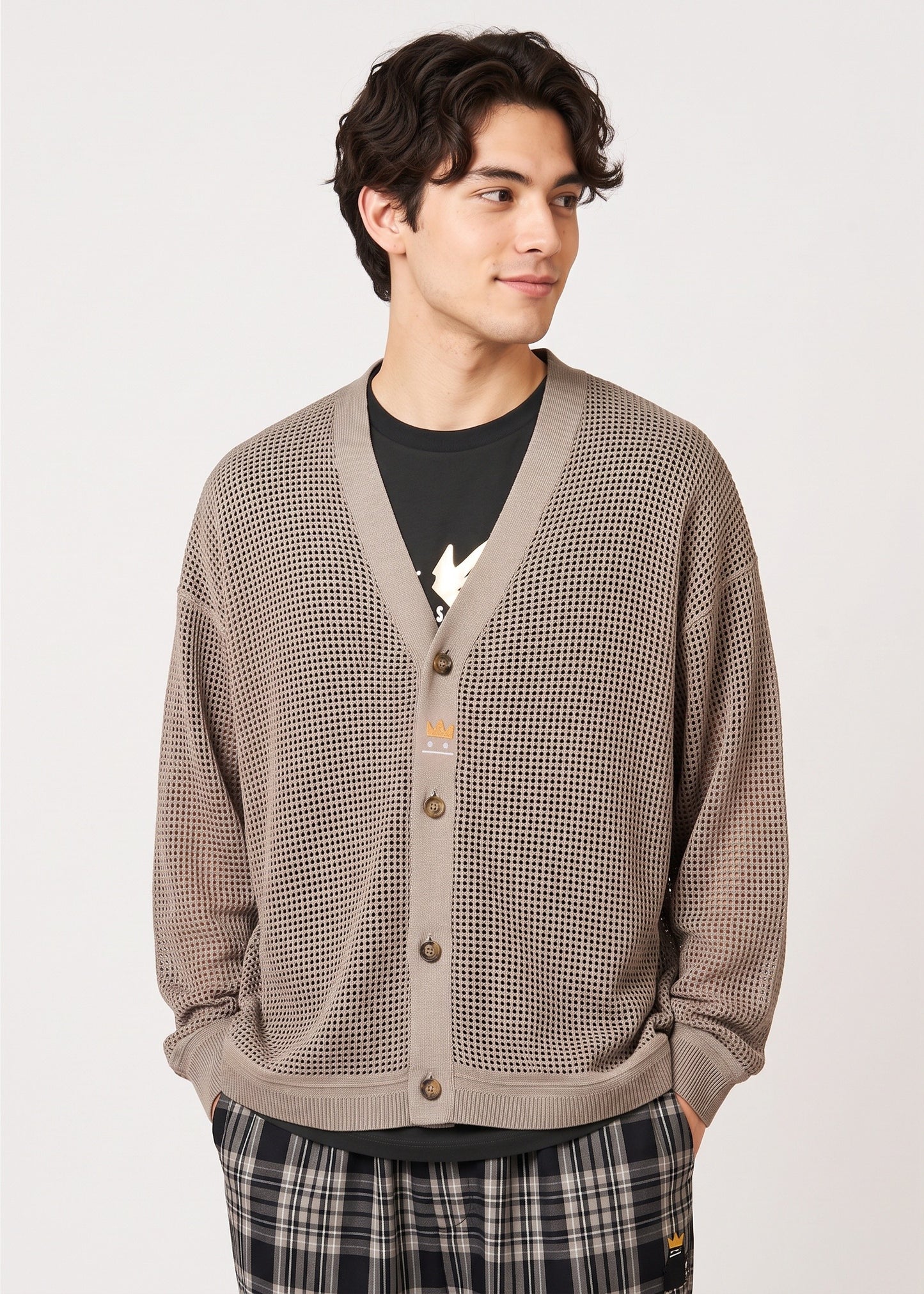 Via Artists unisex beige mesh knit V-neck cardigan with crown embroidery worn by a man