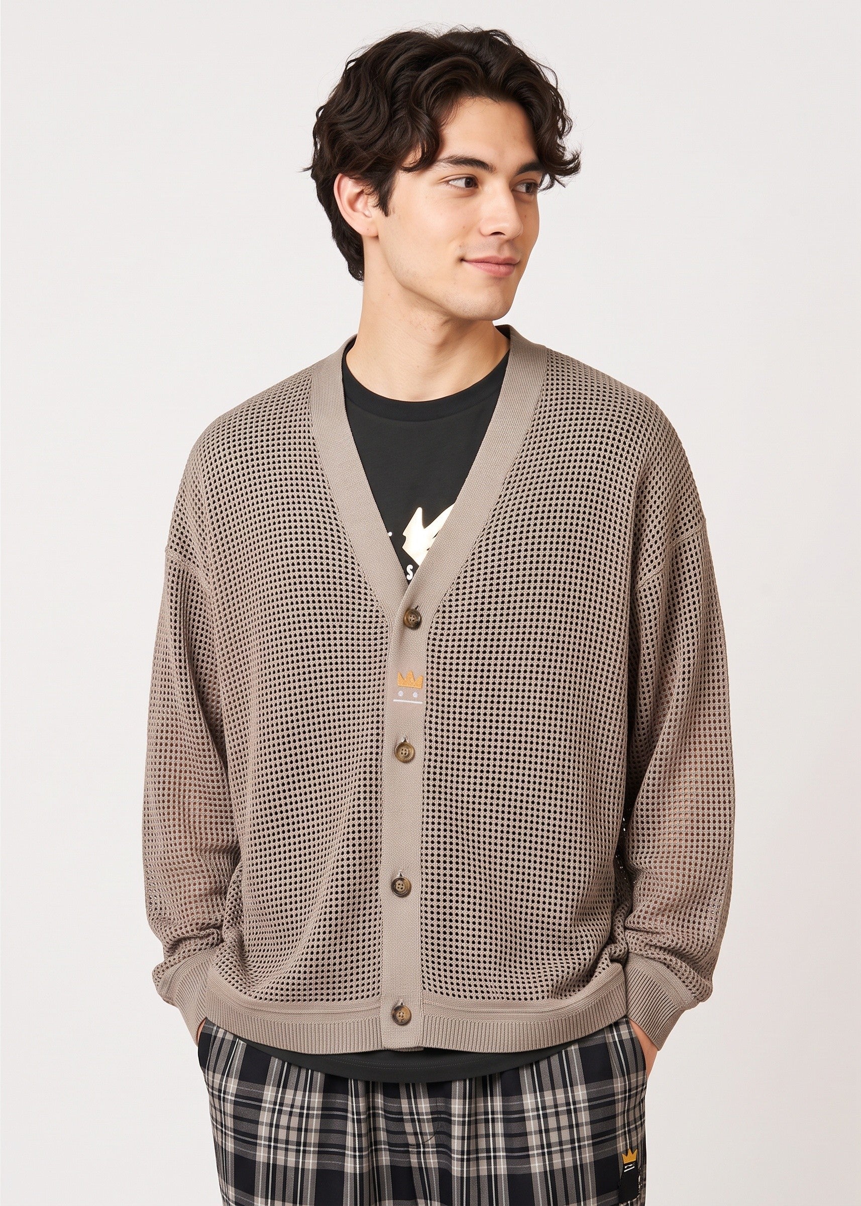 Via Artists unisex beige mesh knit V-neck cardigan with crown embroidery worn by a man
