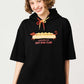 Via Artists black short-sleeve hoodie featuring a long dachshund hot dog graphic and colorful drawstring detail.