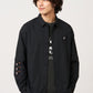Via Artists Ikaku Royal black pinstripe detachable sleeve shirt with red panda embroidery on a male model