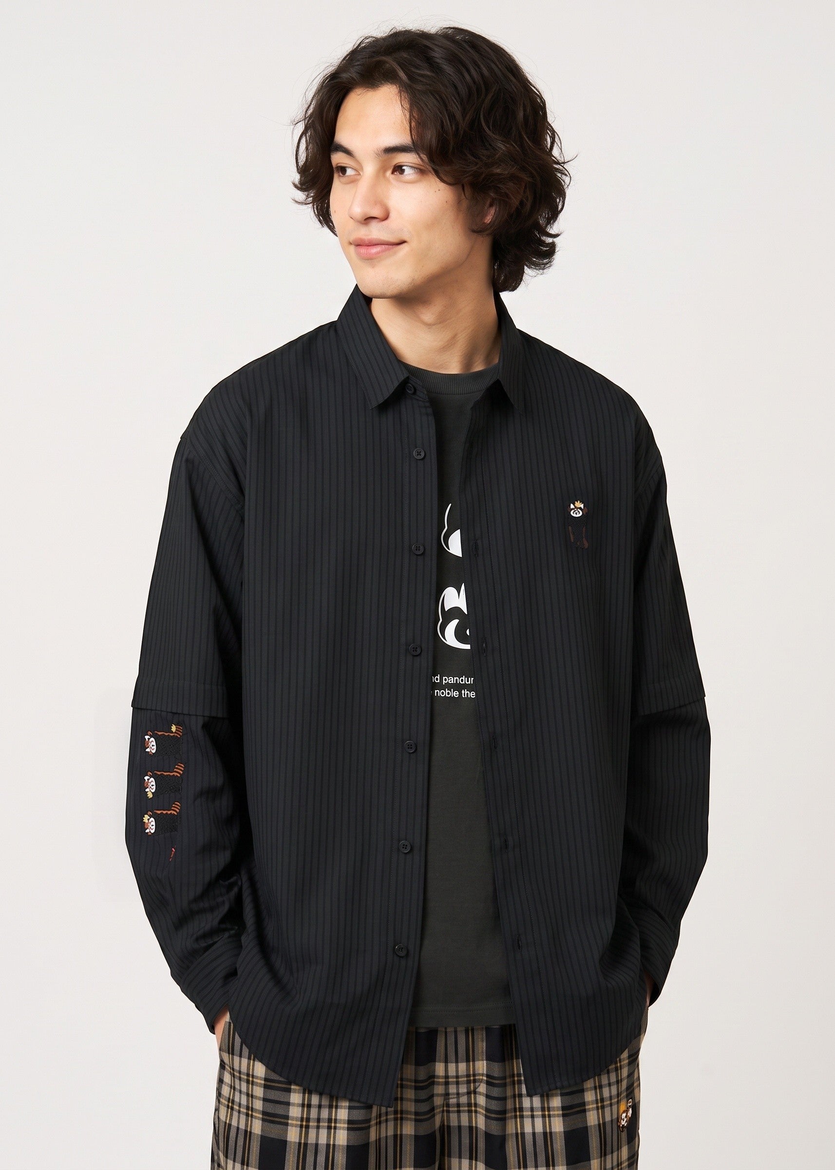 Via Artists Ikaku Royal black pinstripe detachable sleeve shirt with red panda embroidery on a male model