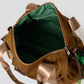 Via Artists Ikaku Lucha Boston shoulder bag interior view showing green lining and zippered pocket