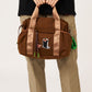 Via Artists Ikaku Lucha Boston shoulder bag in brown nylon with an embroidered red panda wrestler design