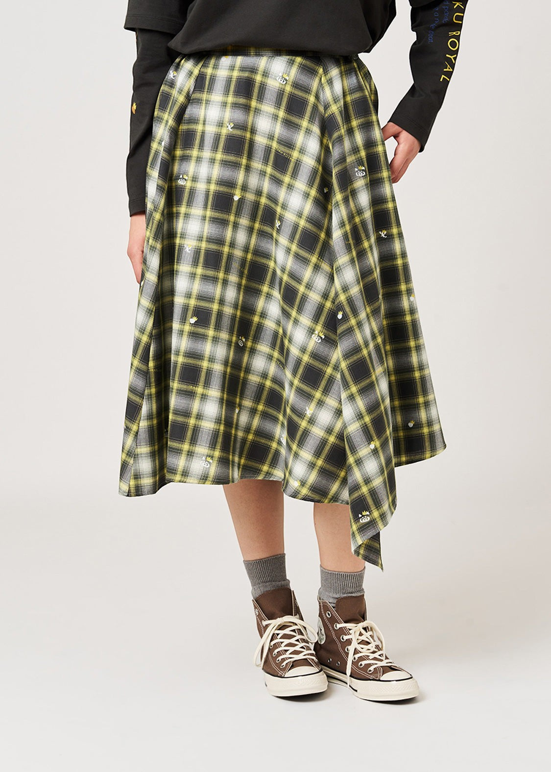 Via Artists Ikaku Royal check skirt in yellow and black plaid with an irregular hem and elastic waistband.