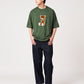 Via Artists Control Bear peach-brushed 5/8 sleeve t-shirt in dark green with a flock print graphic on a male model.