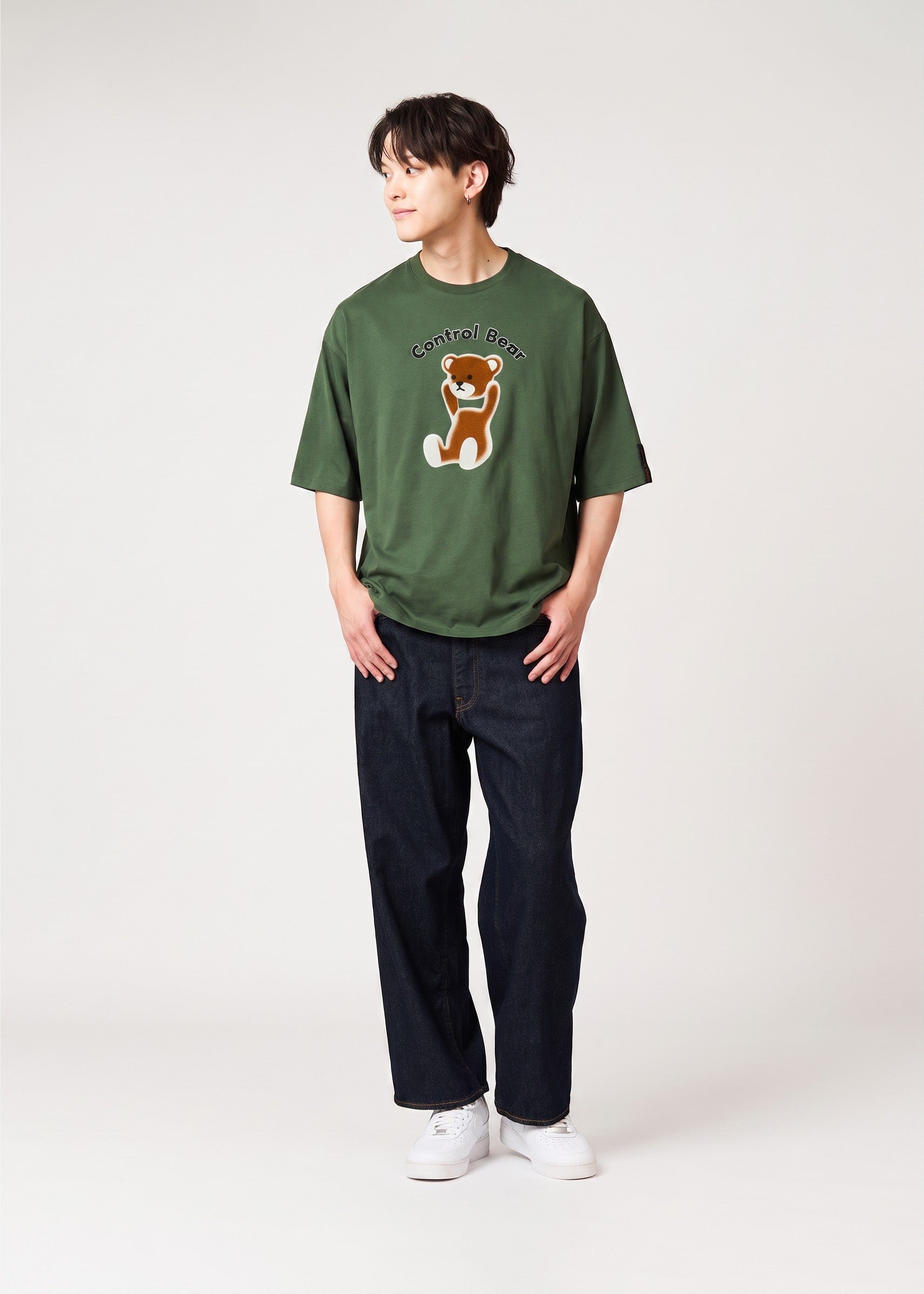 Via Artists Control Bear peach-brushed 5/8 sleeve t-shirt in dark green with a flock print graphic on a male model.