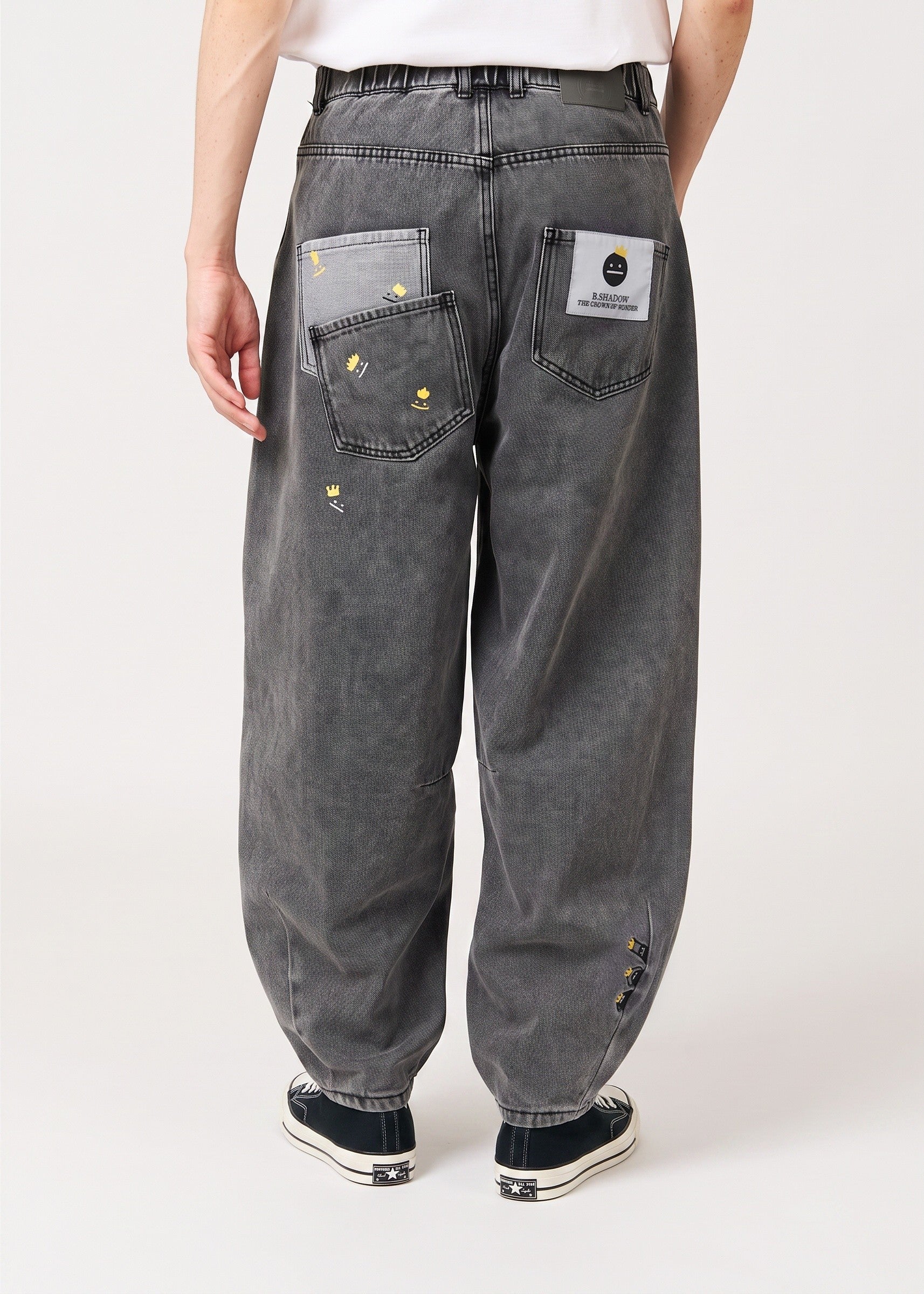 Via Artists unisex balloon denim pants in washed grey with crown embroidery and elastic back waistband, back view