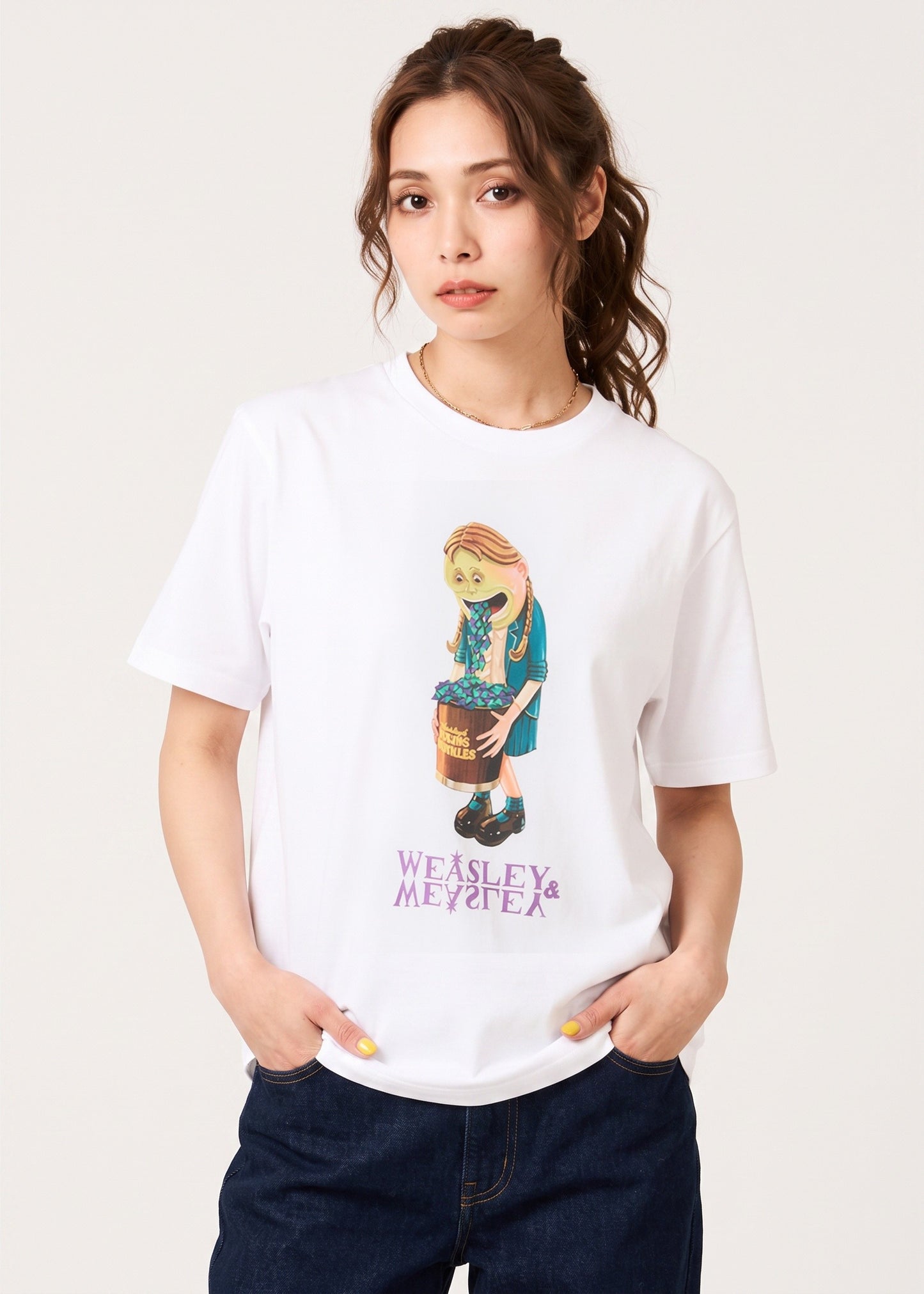 Via Artists white cotton unisex T-shirt featuring a Harry Potter Puking Pastilles graphic worn by a woman