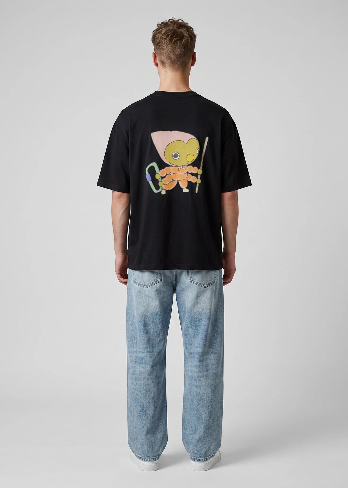 Via Artists Helcovell Guard oversized black cotton t-shirt with a colorful character graphic on the back