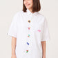Via Artists white short-sleeved shirt with embroidered Harry Potter Honeydukes candy motifs and a relaxed fit