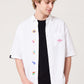 Via Artists Harry Potter Honeydukes white short-sleeved shirt with embroidered candy motifs on a male model