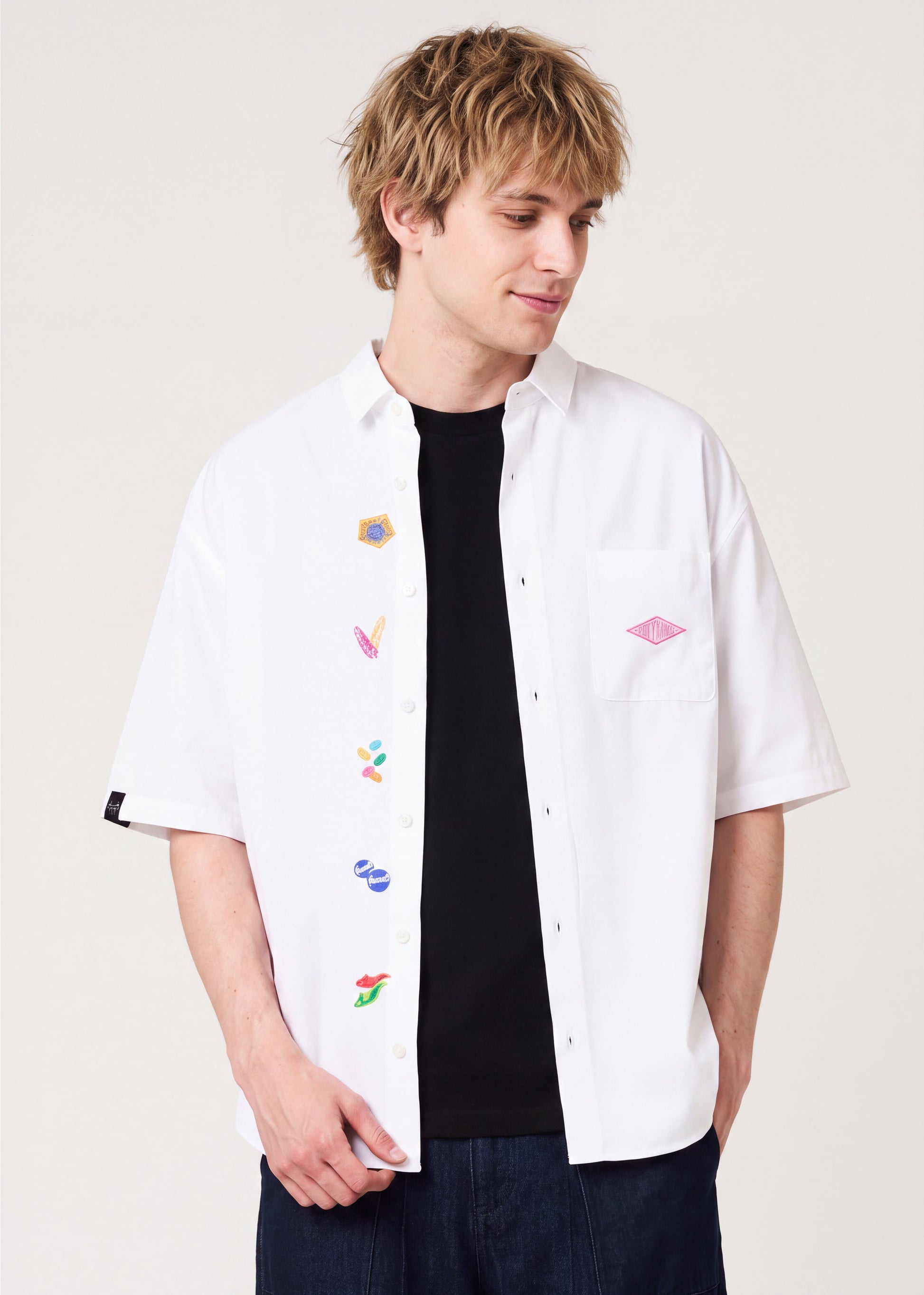 Via Artists Harry Potter Honeydukes white short-sleeved shirt with embroidered candy motifs on a male model