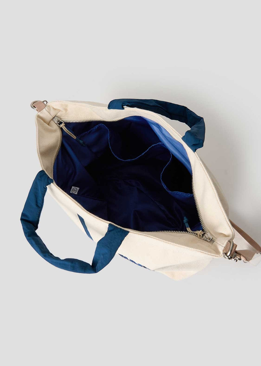 Via Artists Ikaku Goron 2-way tote bag in cream cotton canvas with blue interior lining and multiple storage pockets