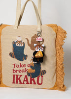 Via Artists Ikaku Take A Break jacquard tote bag in beige with red panda graphic, fringe sides, and plush charm.