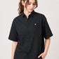 Via Artists Ikaku Royal black pinstriped short-sleeve shirt with red panda embroidery worn by a woman