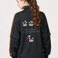 Via Artists Ikaku Royal black track jacket with red panda embroidery and detachable sleeves worn by a woman