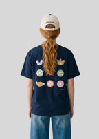 Via Artists Kazukuma beige 6-panel cotton baseball cap with adjustable back strap worn by a person from behind