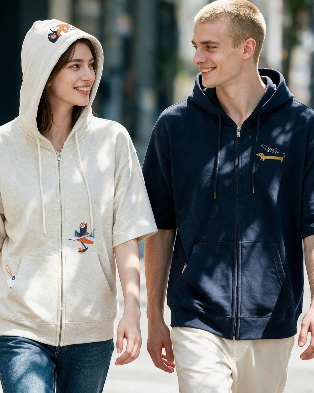 Via Artists Nagasugiru Inu zip hoodies in beige and navy with embroidered airline-themed dachshund designs