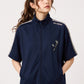 Via Artists navy blue unisex track jacket with detachable sleeves, velour tape accents, and embroidered panda design.